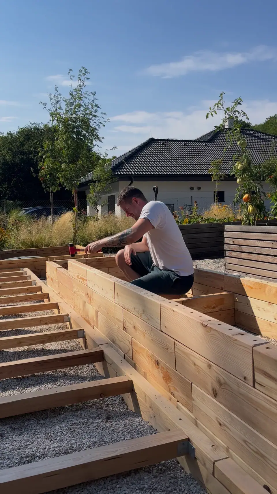 Assembling a wooden raised garden bed layer by layer